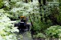 В связи с подтоплением частных домовладений по переулку Токарева после сильных залповых дождей администрацией округа организована работа по прочистке водопропускного канала